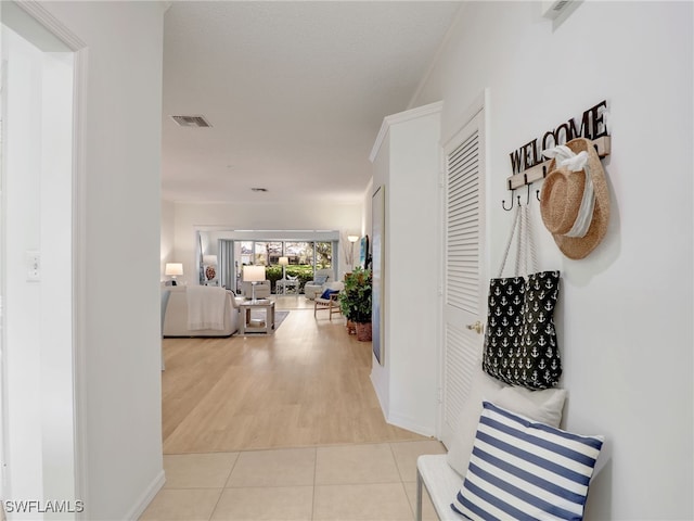 808 Arbor Lake Dr Unit 8-105, Naples, FL 34110 - hall with light tile patterned flooring and baseboards