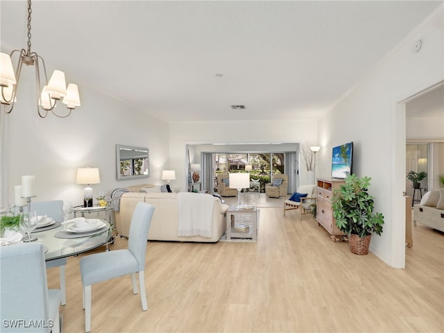 808 Arbor Lake Dr Unit 8-105, Naples, FL 34110 - living area with light wood-type flooring and a chandelier