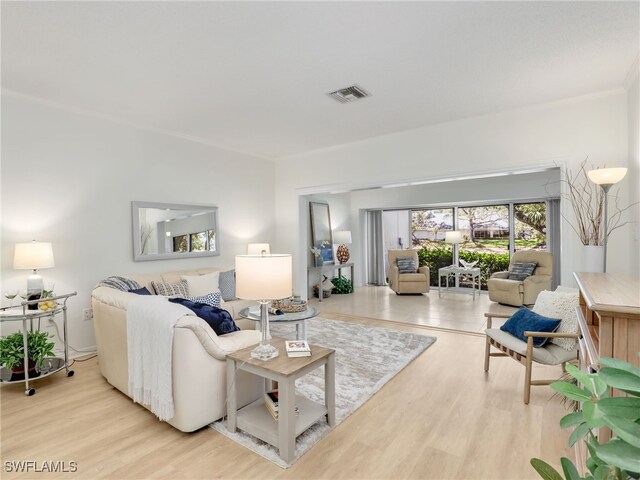 808 Arbor Lake Dr Unit 8-105, Naples, FL 34110 - living room featuring wood finished floors and ornamental molding