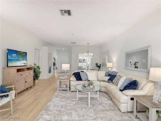 808 Arbor Lake Dr Unit 8-105, Naples, FL 34110 - living area featuring light wood-style flooring and a chandelier