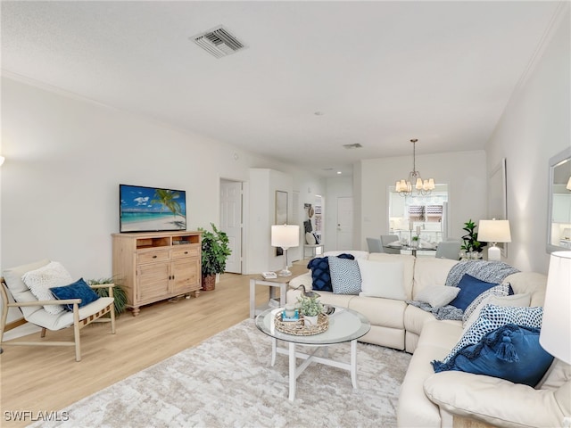 808 Arbor Lake Dr Unit 8-105, Naples, FL 34110 - living area featuring a chandelier and light wood-style floors
