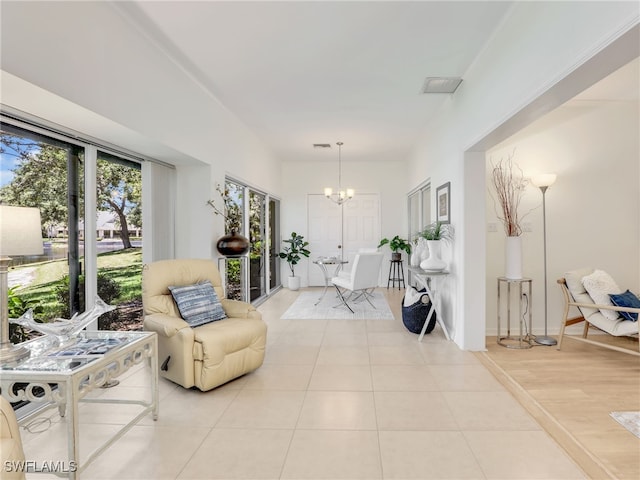 808 Arbor Lake Dr Unit 8-105, Naples, FL 34110 - living area featuring a chandelier and light tile patterned floors