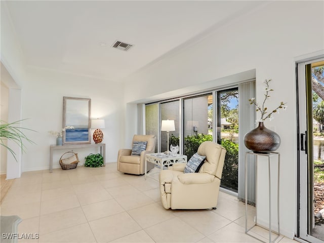 808 Arbor Lake Dr Unit 8-105, Naples, FL 34110 - sitting room with plenty of natural light, light tile patterned floors, and baseboards