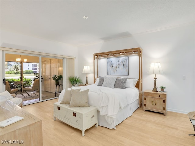 808 Arbor Lake Dr Unit 8-105, Naples, FL 34110 - bedroom featuring access to outside, light wood-style floors, and ornamental molding