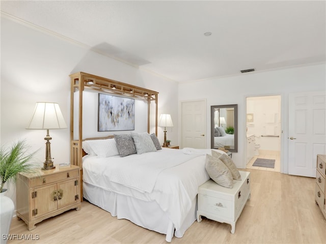 808 Arbor Lake Dr Unit 8-105, Naples, FL 34110 - bedroom with crown molding, light wood-style flooring, and connected bathroom