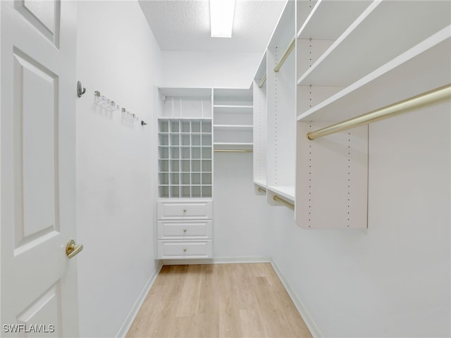808 Arbor Lake Dr Unit 8-105, Naples, FL 34110 - spacious closet featuring wood finished floors