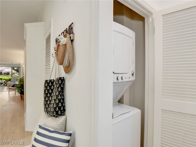 808 Arbor Lake Dr Unit 8-105, Naples, FL 34110 - laundry area with estacked washer and dryer and wood finished floors