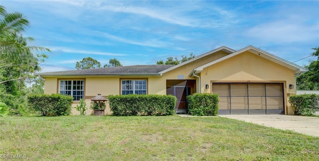 ranch-style home with a front lawn and a garage