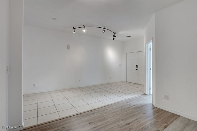 spare room featuring light wood-type flooring