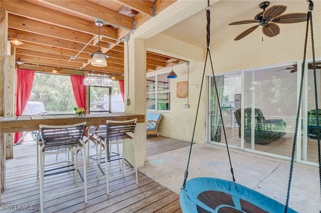 sunroom / solarium with ceiling fan