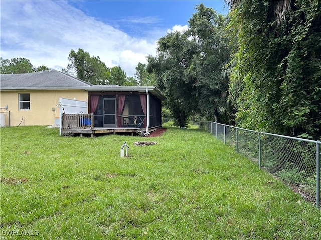 view of yard featuring a sunroom