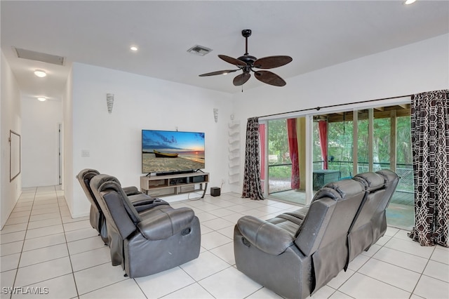 living room with ceiling fan and light tile patterned floors