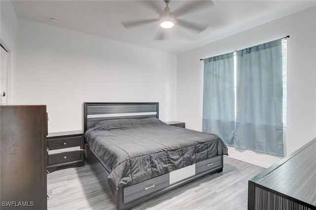 bedroom featuring ceiling fan and light hardwood / wood-style floors