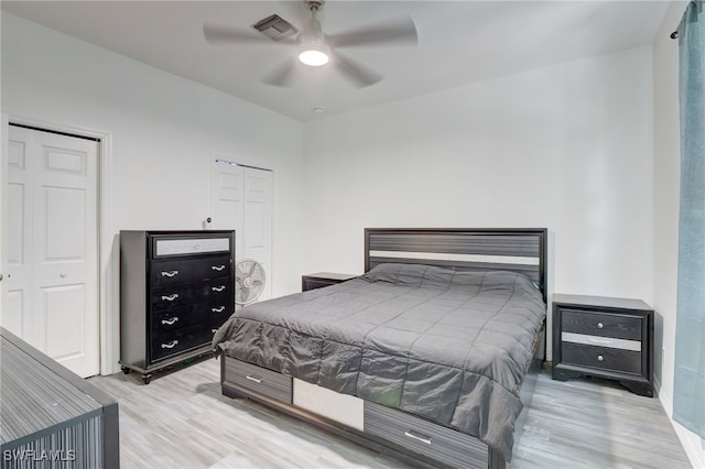 bedroom with ceiling fan and light wood-type flooring