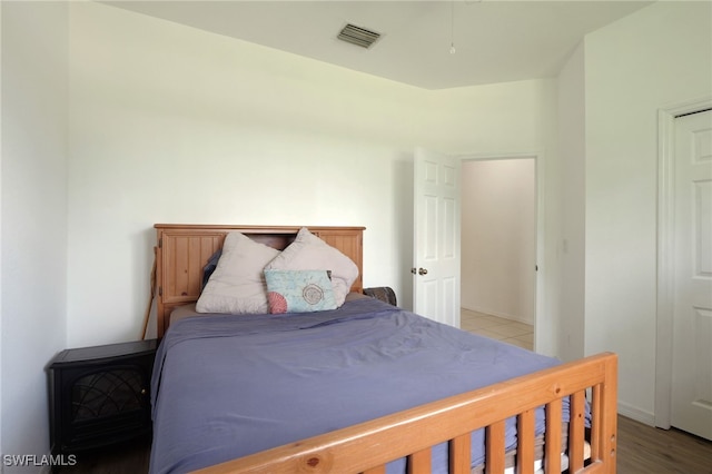 bedroom with light hardwood / wood-style floors