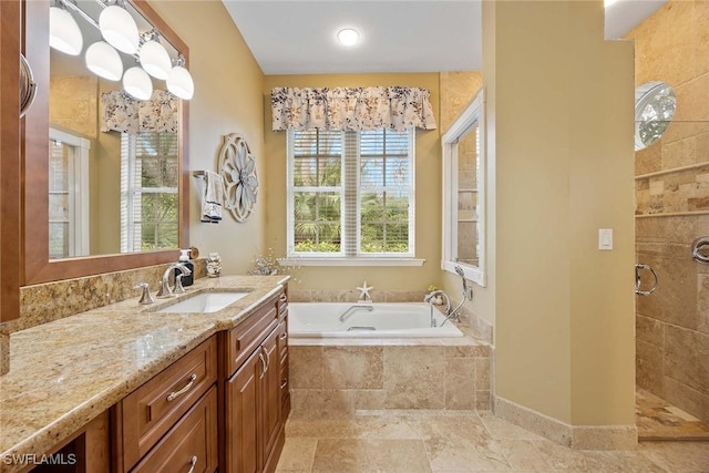 bathroom with separate shower and tub and vanity