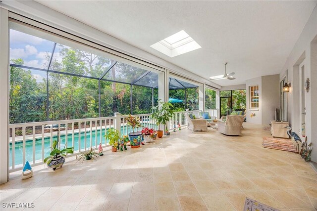 unfurnished sunroom with a skylight