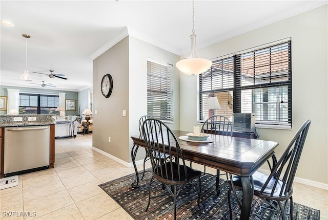 dining room with ceiling fan, light tile patterned flooring, a healthy amount of sunlight, and ornamental molding