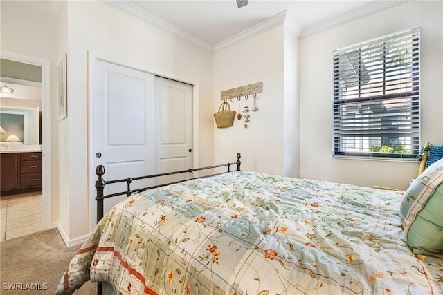 carpeted bedroom featuring a closet and ornamental molding