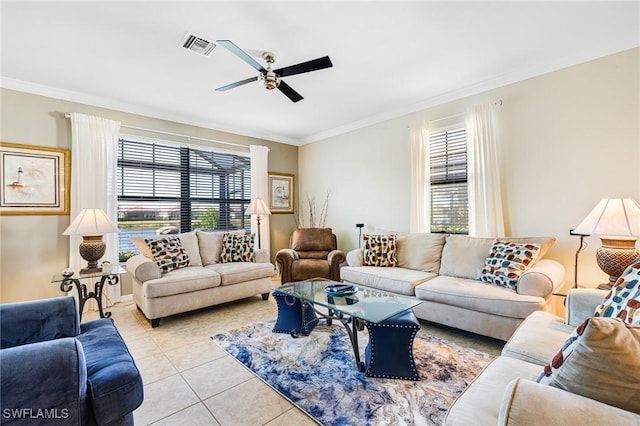 living room featuring light tile patterned floors, a wealth of natural light, ornamental molding, and ceiling fan