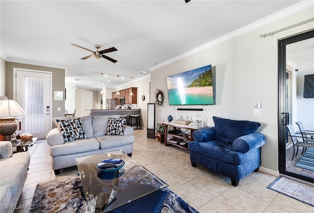 living room featuring ceiling fan, light tile patterned floors, and crown molding