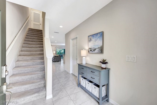 stairs featuring tile patterned floors