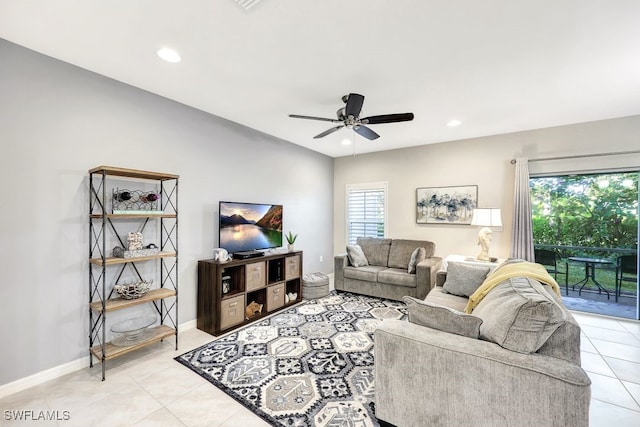 tiled living room featuring ceiling fan