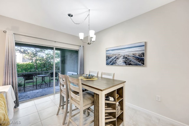 dining area with a notable chandelier and light tile patterned flooring