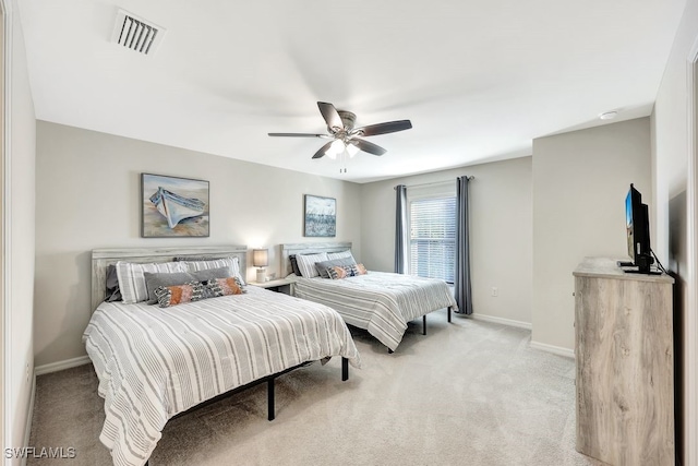 bedroom featuring ceiling fan and light colored carpet