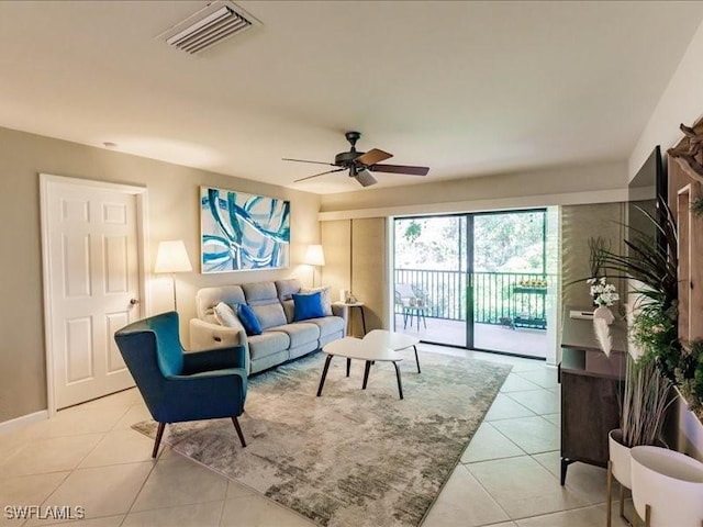 living room featuring ceiling fan and light tile patterned floors