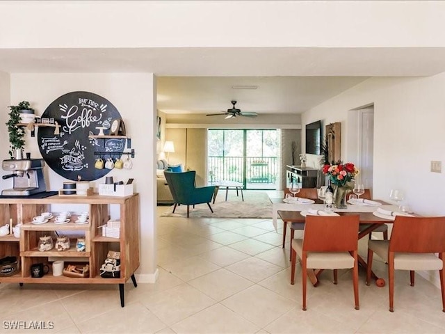 dining space featuring ceiling fan and light tile patterned floors