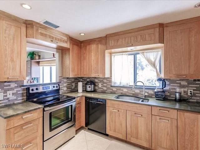 kitchen with electric stove, sink, light tile patterned floors, black dishwasher, and tasteful backsplash