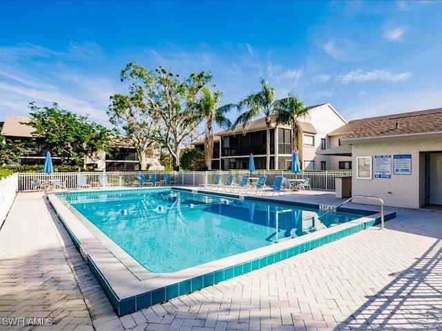 view of swimming pool with a patio area