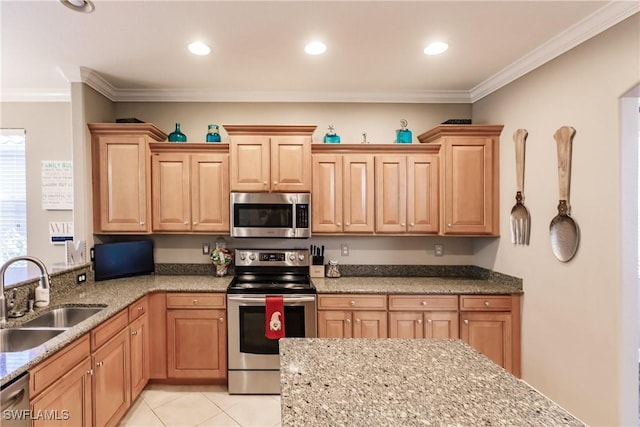 kitchen featuring sink, hanging light fixtures, light stone counters, crown molding, and appliances with stainless steel finishes