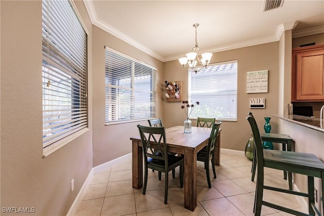 tiled dining space featuring a notable chandelier, plenty of natural light, and ornamental molding