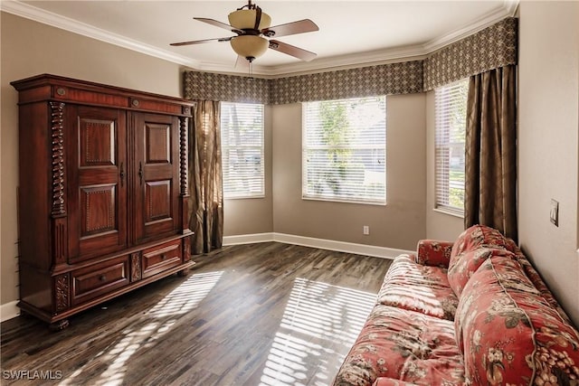 sitting room with crown molding, ceiling fan, and dark wood-type flooring