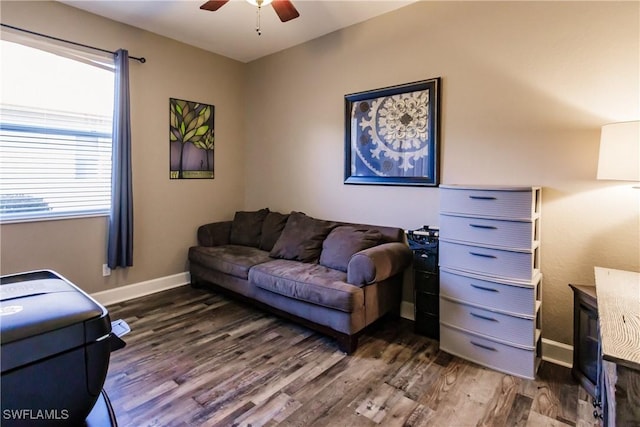 living room with ceiling fan, dark hardwood / wood-style flooring, and a wealth of natural light