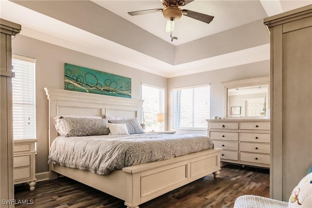 bedroom with ceiling fan, dark wood-type flooring, and ornamental molding