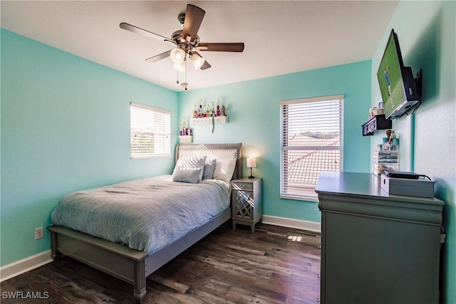 bedroom featuring multiple windows, ceiling fan, and dark hardwood / wood-style floors