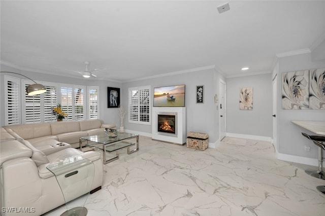 living room featuring ceiling fan and ornamental molding