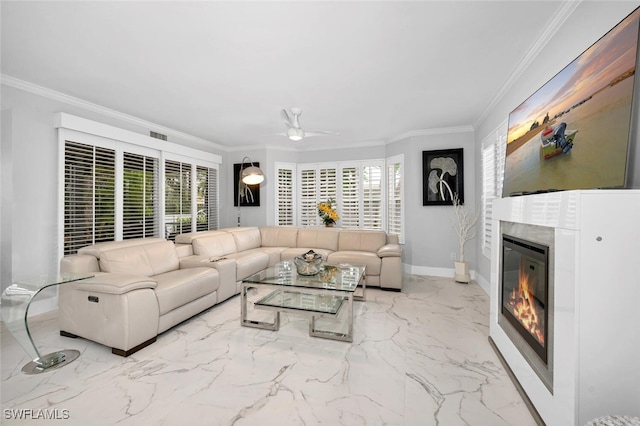 living room with a healthy amount of sunlight, ceiling fan, and ornamental molding