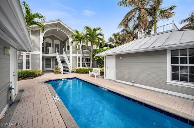 view of swimming pool featuring a patio