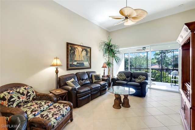 tiled living room with ceiling fan and ornamental molding