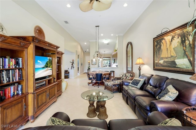 living room featuring ceiling fan and crown molding