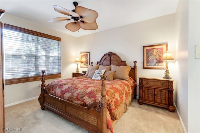 bedroom featuring ceiling fan and light colored carpet