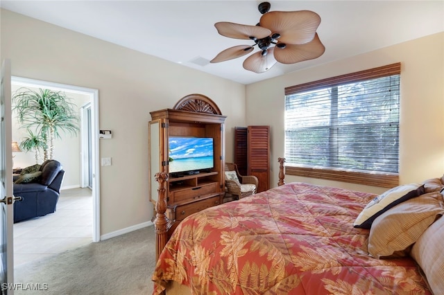 bedroom with light carpet and ceiling fan