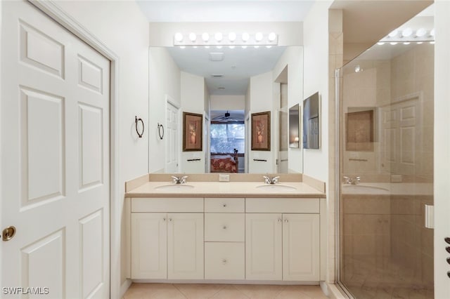 bathroom featuring ceiling fan, tile patterned flooring, vanity, and a shower with shower door