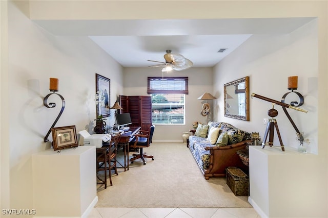 office space featuring ceiling fan and light tile patterned floors