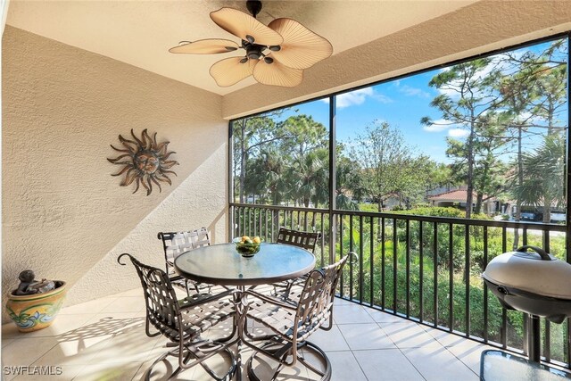 sunroom with a wealth of natural light and ceiling fan