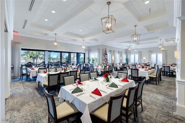 dining space featuring beam ceiling, a wealth of natural light, and coffered ceiling